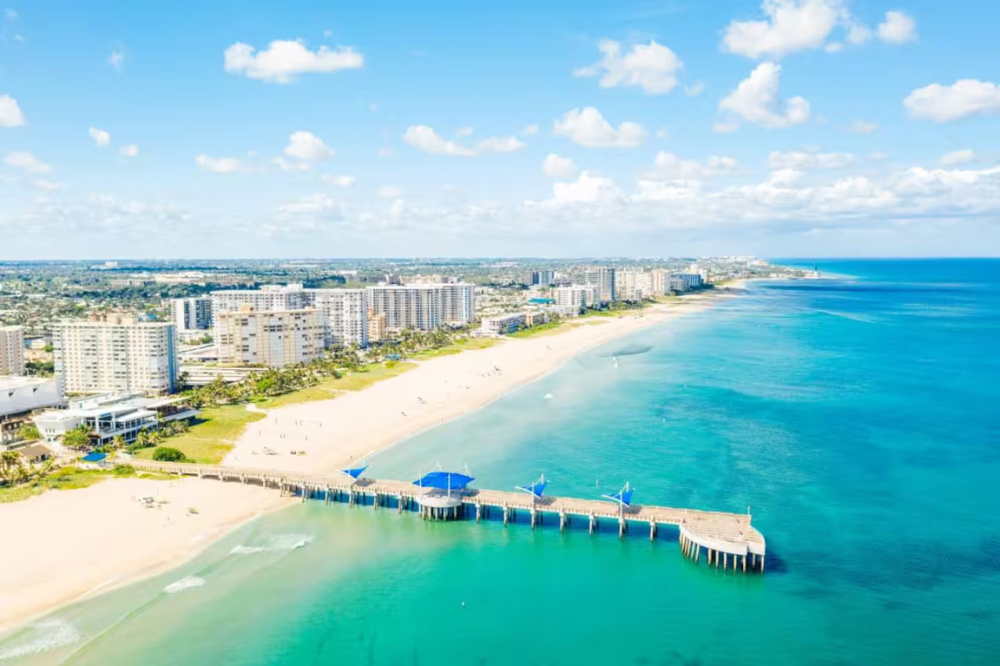 Aerial view of Pompano Beach coastline and pier on a clear day